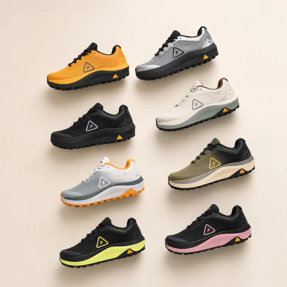 Eight coloured low-cut shoes arranged on a neutral background