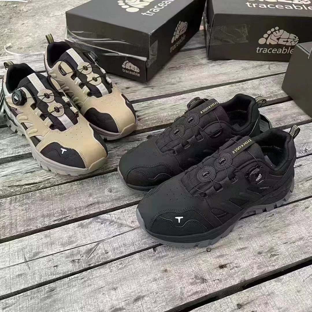 Low-cut hiking shoes displayed on an outdoor wooden table