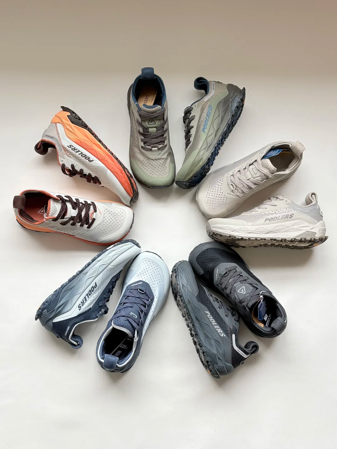 Multiple PODLERS shoes arranged in a circle